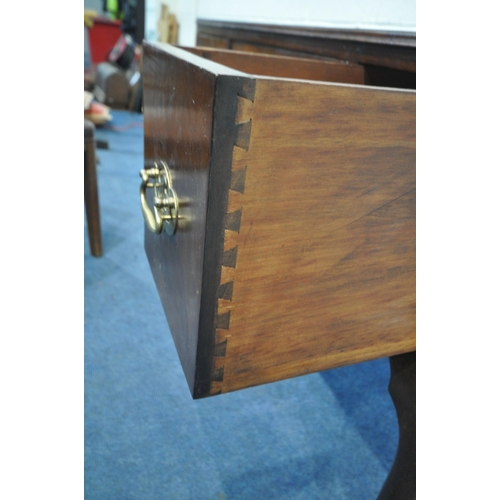 1207 - A 20TH CENTURY MAHOGANY KNEE HOLE DESK, with blue tooled leather writing surface, fitted with three ... 