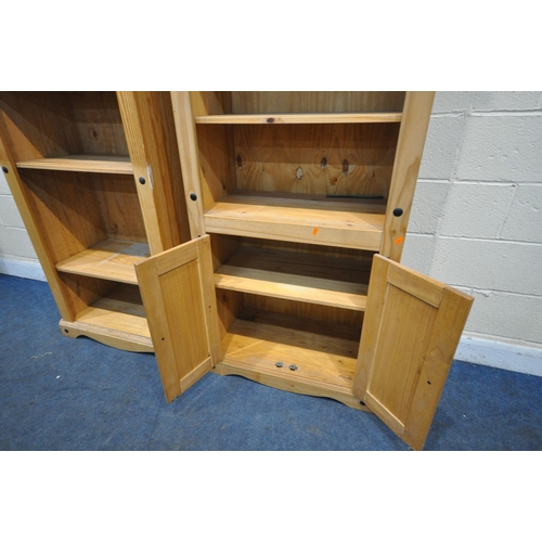 1215 - TWO CORONA PINE OPEN BOOKCASES, one with four adjustable shelves, the other with two shelves and two... 