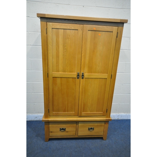 1217 - A SOLID OAK DOUBLE DOOR WARDROBE, with two drawers, width 110cm x depth 60cm x height 191cm (conditi... 