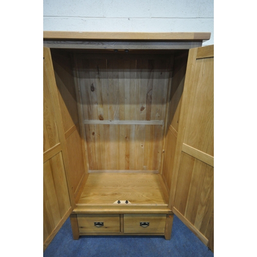 1217 - A SOLID OAK DOUBLE DOOR WARDROBE, with two drawers, width 110cm x depth 60cm x height 191cm (conditi... 