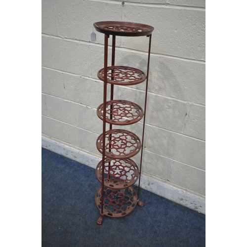 1222 - A BURGUNDY PAINTED CAST ALUMINIUM SIX TIER PAN STAND, of a tapered form, on paw feet, height 123cm (... 