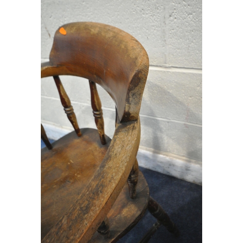 1229 - AN EARLY 20TH CENTURY OAK ARMCHAIR, with arched crest, open armrests, turned supports and front legs... 