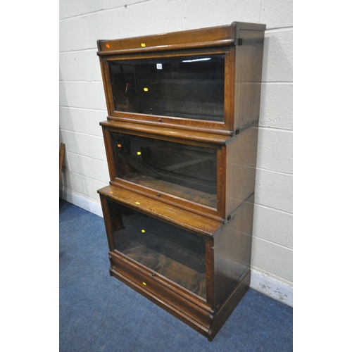 1252 - AN OAK GLOBE WERNICKE BOOKCASE, the three graduated sections with bevelled glass hide and fall doors... 