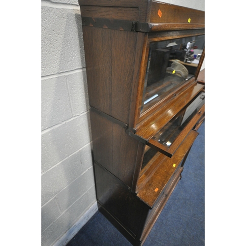 1252 - AN OAK GLOBE WERNICKE BOOKCASE, the three graduated sections with bevelled glass hide and fall doors... 