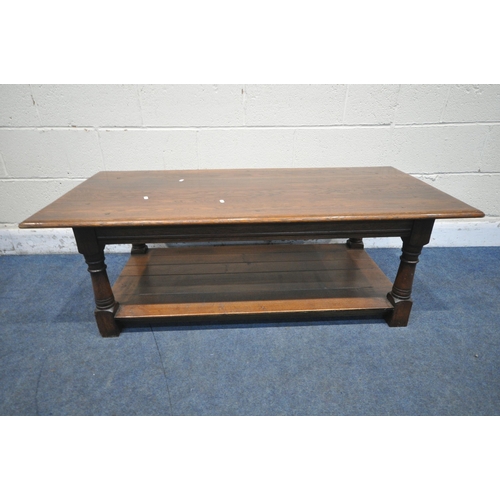 1259 - A TITCHMARSH AND GOODWIN OAK RECTANGULAR COFFEE TABLE, on turned legs, block feet, united by an unde... 