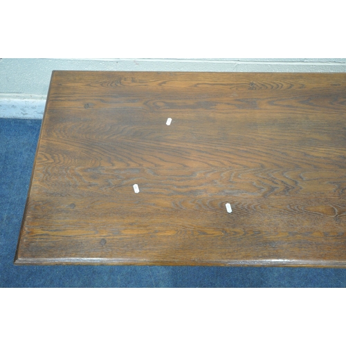 1259 - A TITCHMARSH AND GOODWIN OAK RECTANGULAR COFFEE TABLE, on turned legs, block feet, united by an unde... 