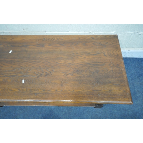 1259 - A TITCHMARSH AND GOODWIN OAK RECTANGULAR COFFEE TABLE, on turned legs, block feet, united by an unde... 