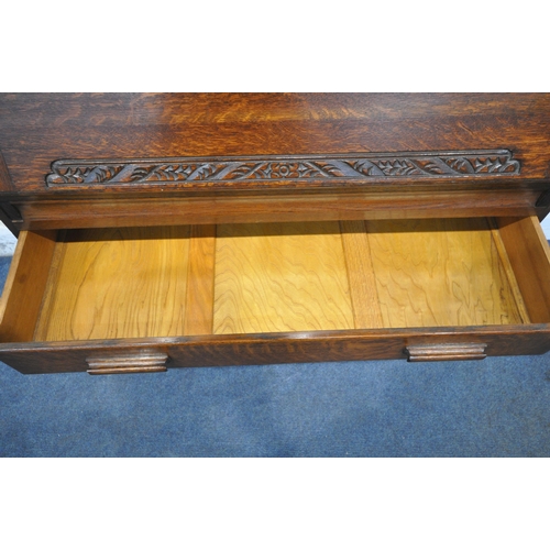 1263 - A 20TH CENTURY OAK BUREAU BOOKCASE, the top with double glazed doors, enclosing three adjustable she... 