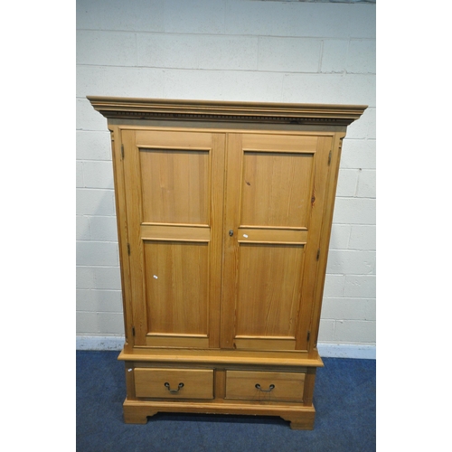 1268 - A MODERN PINE DOUBLE DOOR WARDROBE, with two drawers, on bracket feet, width 137cm x depth 66cm x he... 