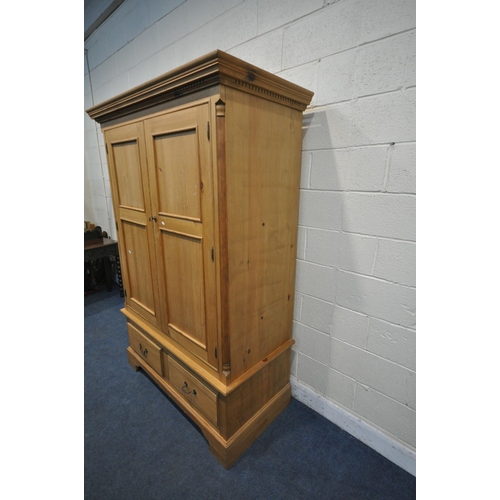 1268 - A MODERN PINE DOUBLE DOOR WARDROBE, with two drawers, on bracket feet, width 137cm x depth 66cm x he... 