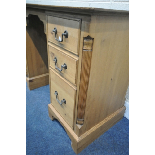 1269 - A MODERN PINE KNEE HOLE DESK, fitted with two banks of three drawers, on bracket feet, width 123cm x... 