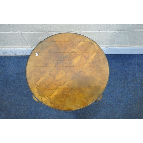 1272 - AN ART DECO WALNUT THREE TIER CIRCULAR OCCASIONAL TABLE, the top surface quarter veneered, with a gl... 