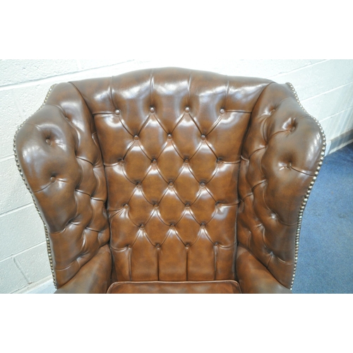 1273 - A BROWN LEATHER BUTTONED WING BACK ARMCHAIR, with studded detail, width 79cm x depth 86cm x height 1... 