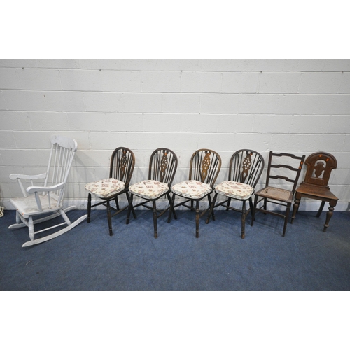 1284 - A SELECTION OF CHAIRS, to include a set of four 20th century oak wheel back chairs, an oak hall chai... 