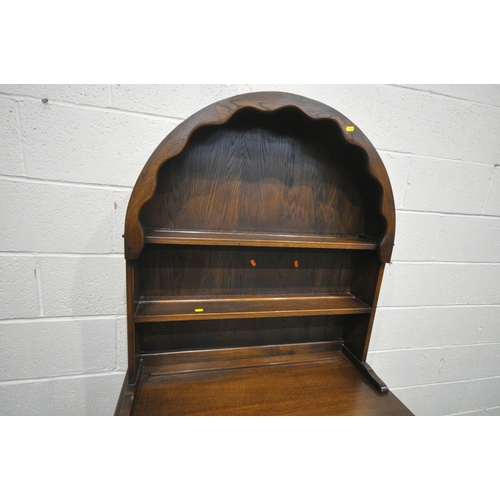 1289 - A 20TH CENTURY OAK DRESSER, the arched top with a two tier plate rack, on a base with two drawers ov... 