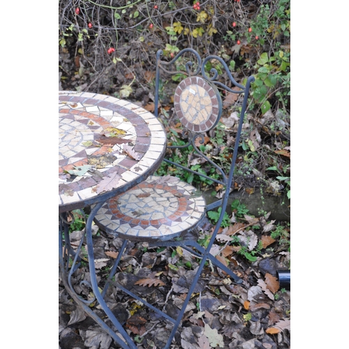 1004 - A METAL CIRCULAR GARDEN TABLE, with a tile insert, 70cm diameter x height 75cm, and two matching fol... 