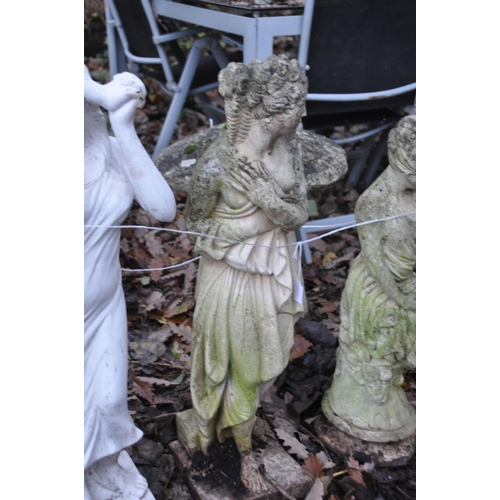 1012 - THREE WEATHERED COMPOSITE GARDEN FIGURES, of scantily clad ladies, max height 80cm, and two plastic ... 