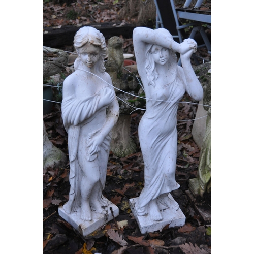 1012 - THREE WEATHERED COMPOSITE GARDEN FIGURES, of scantily clad ladies, max height 80cm, and two plastic ... 