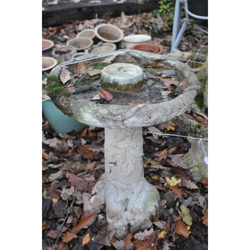 1014 - A WEATHERED COMPOSITE BIRD BATH, of a tree type form, diameter 47cm x height 62cm, and another bird ... 