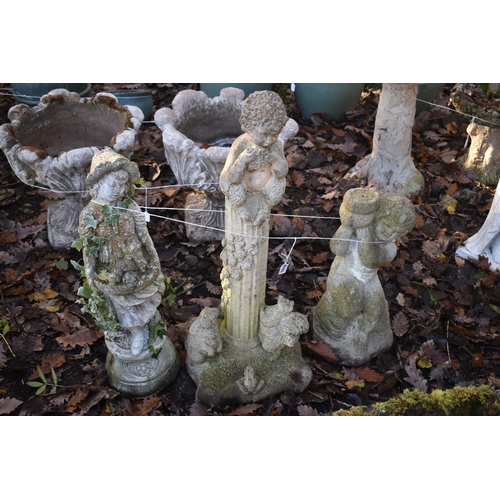 1018 - A WEATHERED COMPOSITE GARDEN FIGURE OF CHERUB ON A REEDED PILLAR, height 86c, along with another com... 