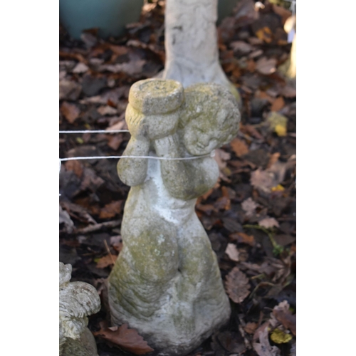 1018 - A WEATHERED COMPOSITE GARDEN FIGURE OF CHERUB ON A REEDED PILLAR, height 86c, along with another com... 