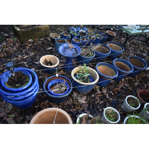 1024 - A SELECTION OF BLUE GLAZED PLANTERS, to include a set of three, two others, along with seven plastic... 