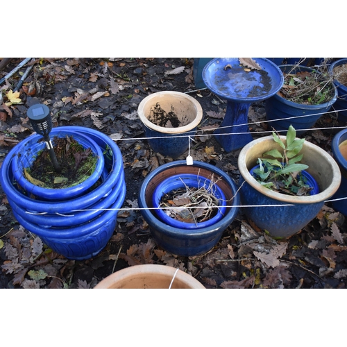 1024 - A SELECTION OF BLUE GLAZED PLANTERS, to include a set of three, two others, along with seven plastic... 