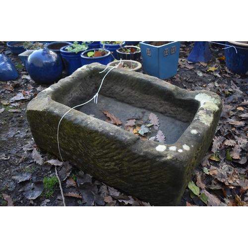 1026 - A RECTANGULAR SANDSTONE TROUGH, length 69cn x 46cm x height 30cm (condition report: one corner with ... 