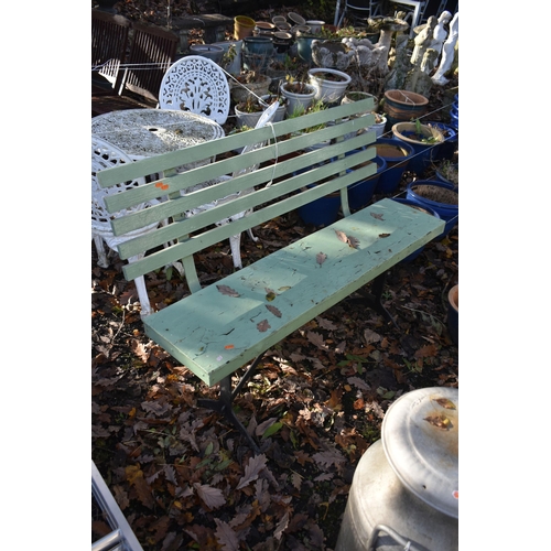 1030 - A PAINTED TEAK SLATTED BENCH, on a wrought iron trestle base, length 129cm (condition report: paint ... 