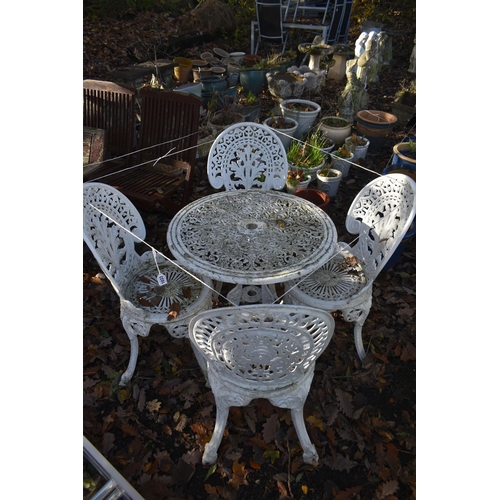 1033 - A WHITE PAINTED CAST ALUMINIUM CIRCULAR GARDEN TABLE, three matching chairs, and a similar chair (co... 