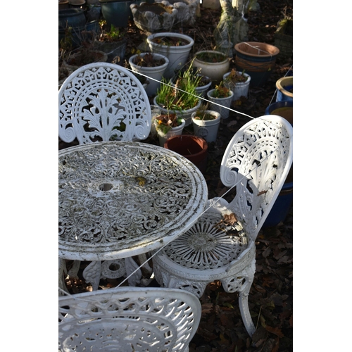 1033 - A WHITE PAINTED CAST ALUMINIUM CIRCULAR GARDEN TABLE, three matching chairs, and a similar chair (co... 