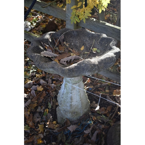 1037 - A WEATHERED COMPOSITE SHELL SHAPED BIRD BATH, height 68cm, along with a bird bath base (condition re... 