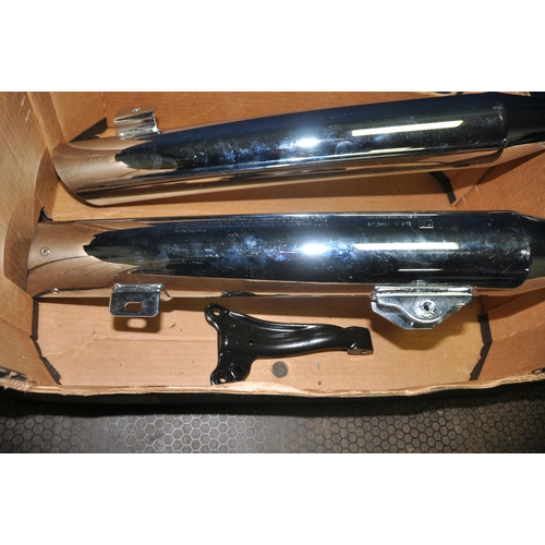 1051 - TWO HARLEY DAVIDSON FAT BOY EXHAUST SILENCERS and a hanging bracket, stamped 64705-08A HDI SP73 and ... 