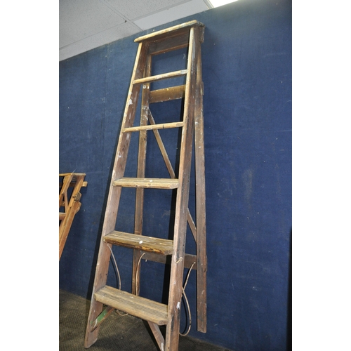 1054 - TWO VINTAGE WOODEN STEP LADDERS comprising of a 160cm high five rung  and a Hatherley Jones Patent 8... 