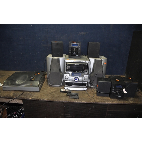 1063 - A SELECTION OF AUDIO EQUIPMENT comprising of two Bush NE 8061 mini hi fi's both with remotes, a Bush... 