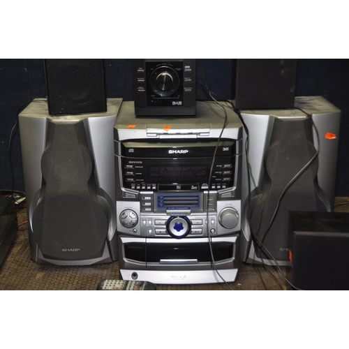 1063 - A SELECTION OF AUDIO EQUIPMENT comprising of two Bush NE 8061 mini hi fi's both with remotes, a Bush... 