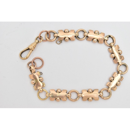 12 - A LATE VICTORIAN BRACELET, the shaped links with engraved foliate design and beaded detail, to the l... 