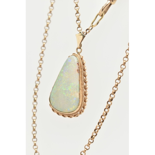 15 - AN OPAL PENDANT AND CHAIN, the triangular opal within a collet and double rope twist surround, suspe... 