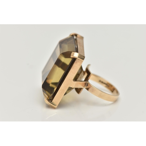 16 - A 9CT GOLD SMOKY QUARTZ RING, designed as a large square smoky quartz within a four claw setting, 9c... 