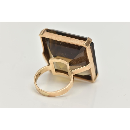 16 - A 9CT GOLD SMOKY QUARTZ RING, designed as a large square smoky quartz within a four claw setting, 9c... 