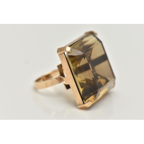 16 - A 9CT GOLD SMOKY QUARTZ RING, designed as a large square smoky quartz within a four claw setting, 9c... 