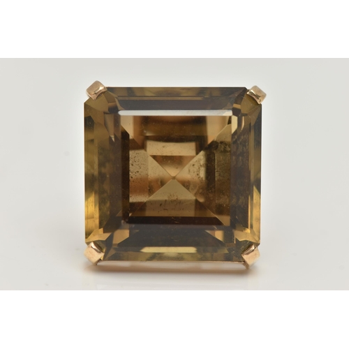 16 - A 9CT GOLD SMOKY QUARTZ RING, designed as a large square smoky quartz within a four claw setting, 9c... 