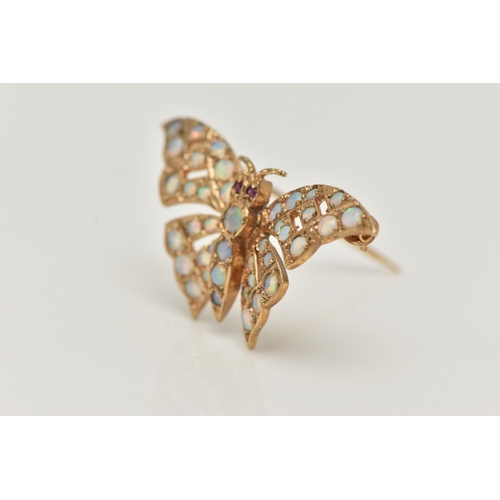 17 - A 9CT GOLD OPAL AND RUBY BUTTERFLY BROOCH, the butterfly body and wings set with circular opal caboc... 