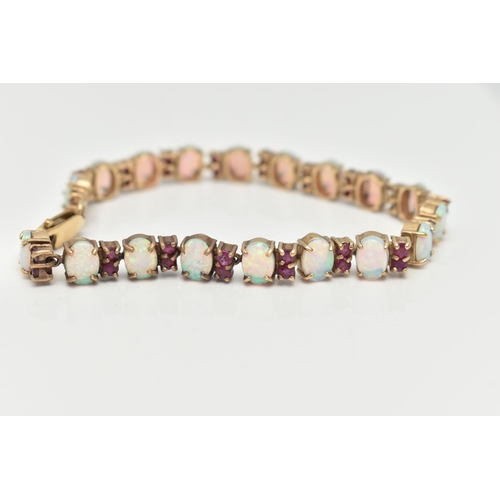 18 - A 9CT GOLD OPAL AND RUBY BRACELET, designed as oval opal cabochons each interspaced by two circular ... 