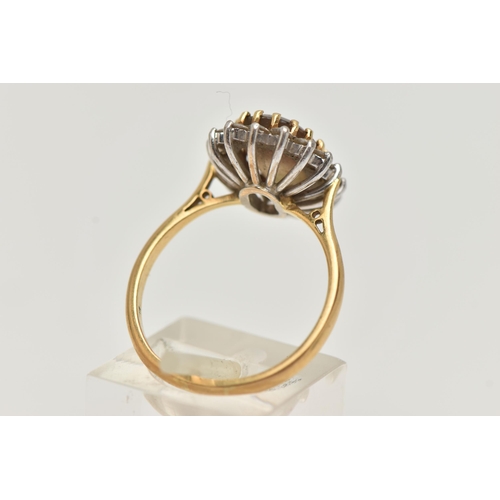 19 - AN 18CT GOLD SMOKY QUARTZ AND DIAMOND CLUSTER RING, the oval smoky quartz within a brilliant cut dia... 