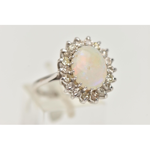 25 - AN OPAL AND DIAMOND CLUSTER RING, designed as a central oval opal cabochon within a single cut diamo... 