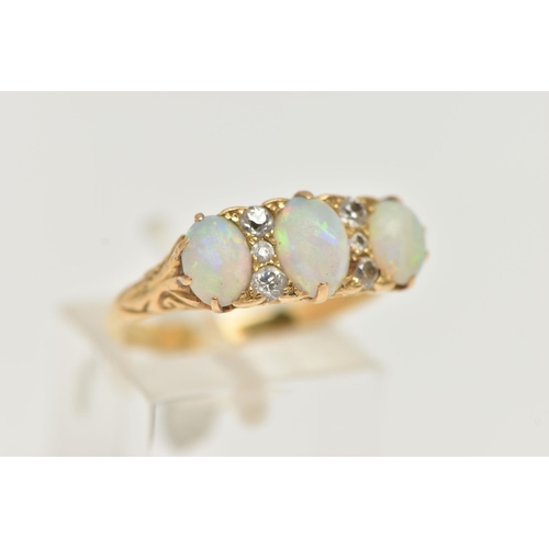 29 - A LATE VICTORIAN OPAL AND DIAMOND RING, designed as three oval opal cabochons interspaced by a total... 