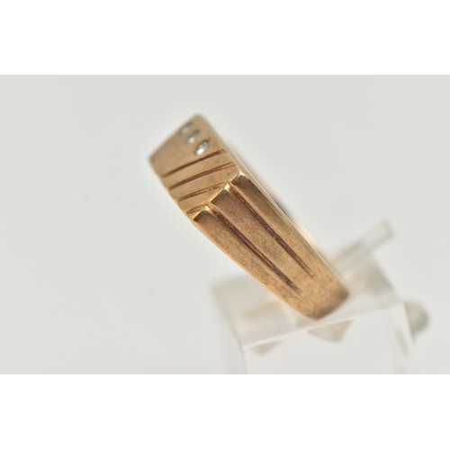 36 - A GENTS 9CT GOLD DIAMOND SIGNET RING, rectangular signet set with three small, round brilliant cut d... 