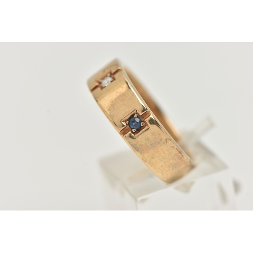 37 - A GENTS 9CT GOLD SAPPHIRE AND DIAMOND RING, set with a central round brilliant cut diamond, flanked ... 