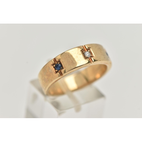 37 - A GENTS 9CT GOLD SAPPHIRE AND DIAMOND RING, set with a central round brilliant cut diamond, flanked ... 